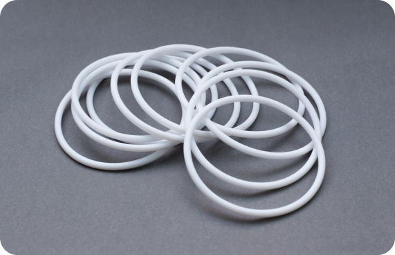 White O-rings spread out in a stack