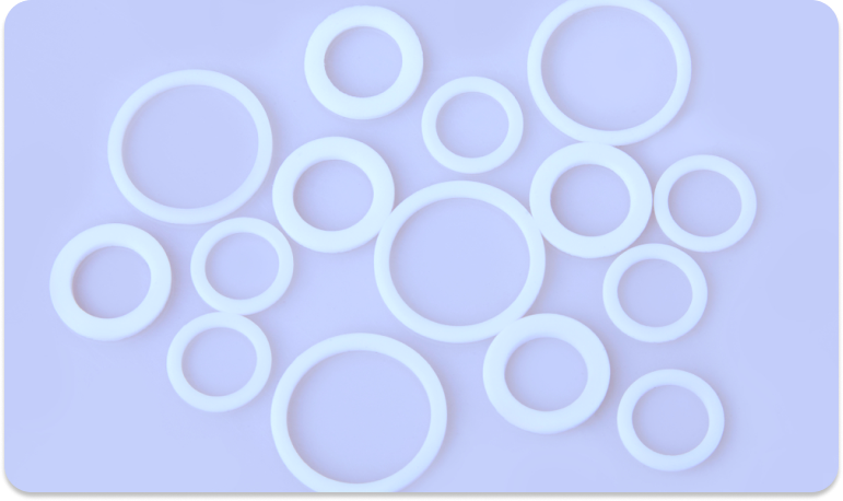 White o-rings laid out on a blue background