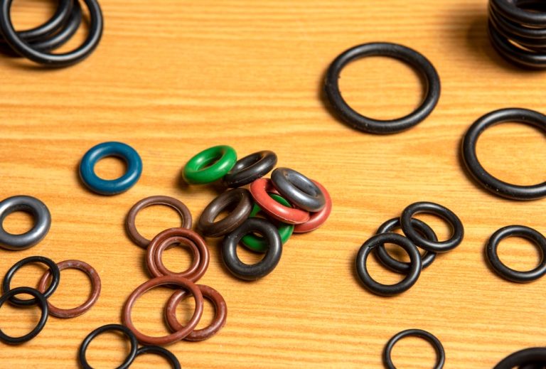 O-rings of different sizes on a wood table